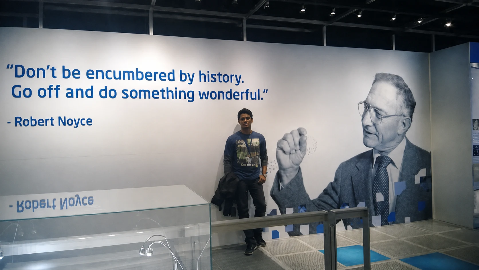 Siva Satyendra Sahoo beside a Robert Noyce exhibit at the Intel Museum
